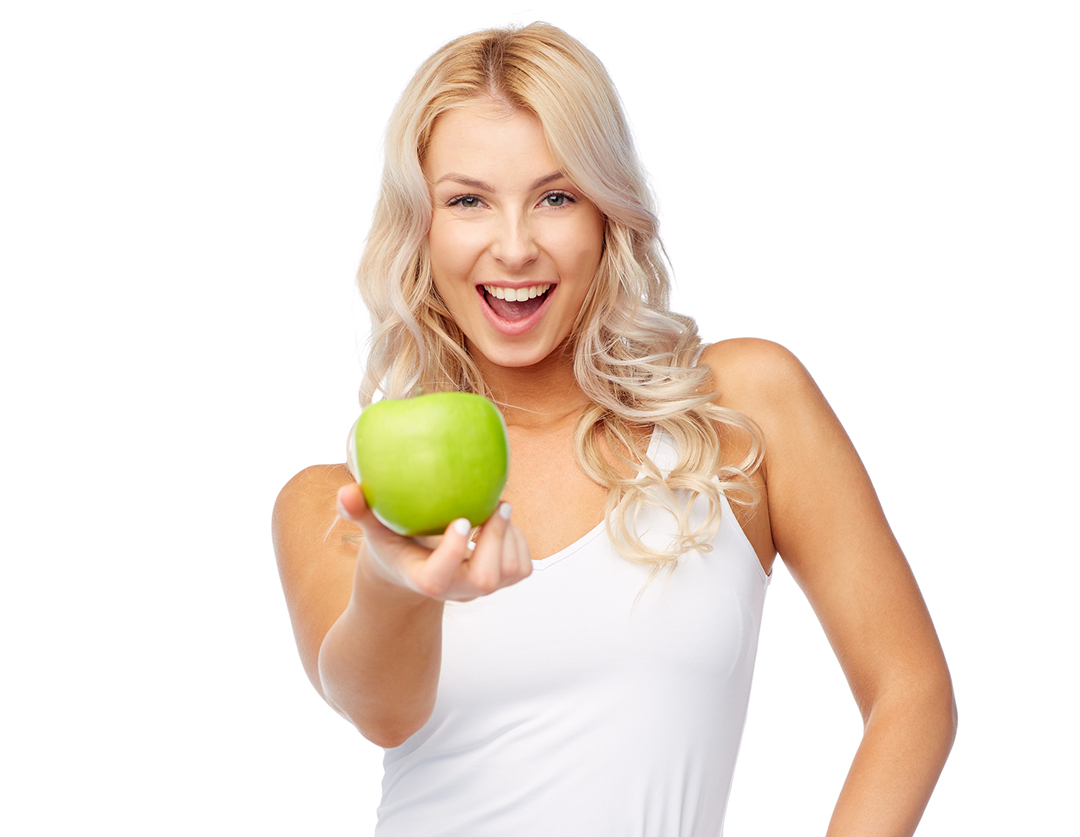 happy beautiful young woman with green apple