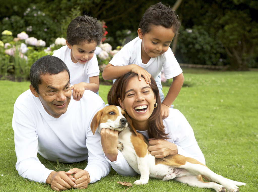 a happy family with a dog