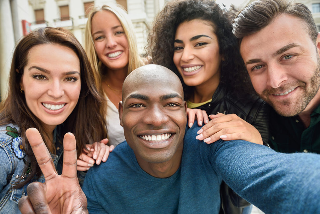 Multiracial group of young people taking selfie