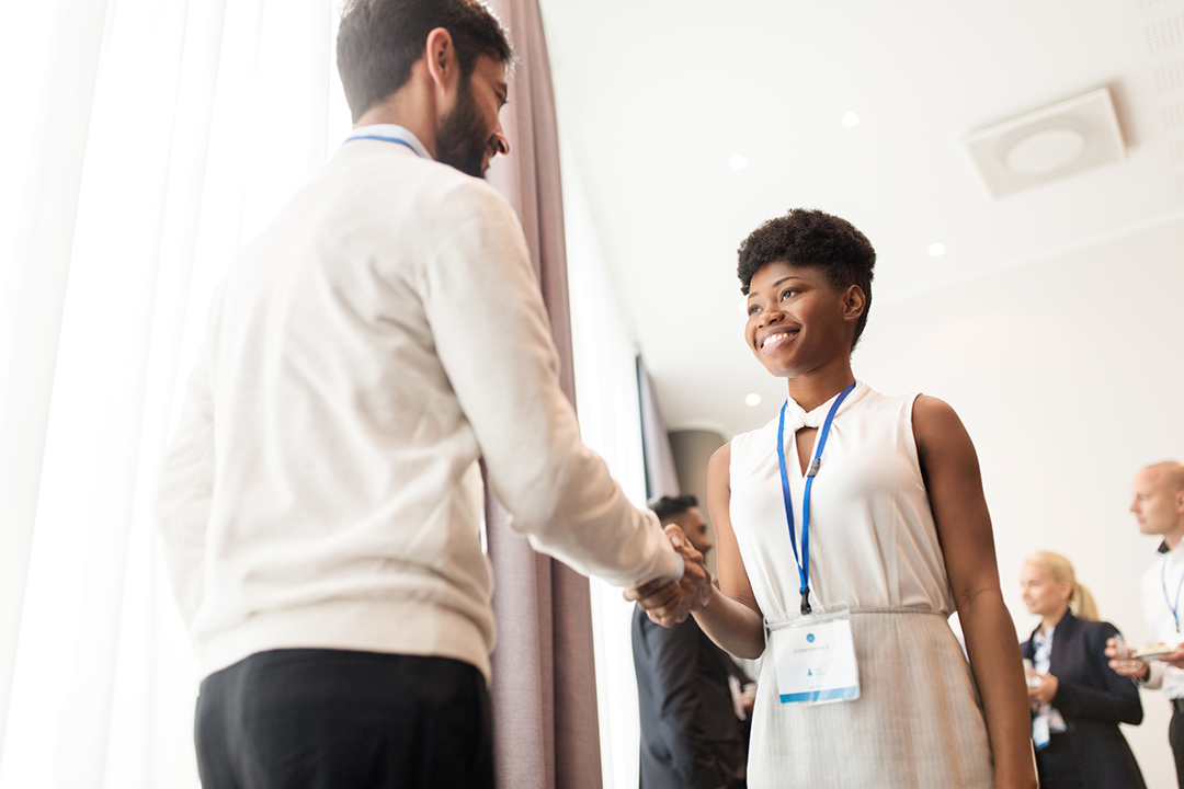 handshake of people at business conference