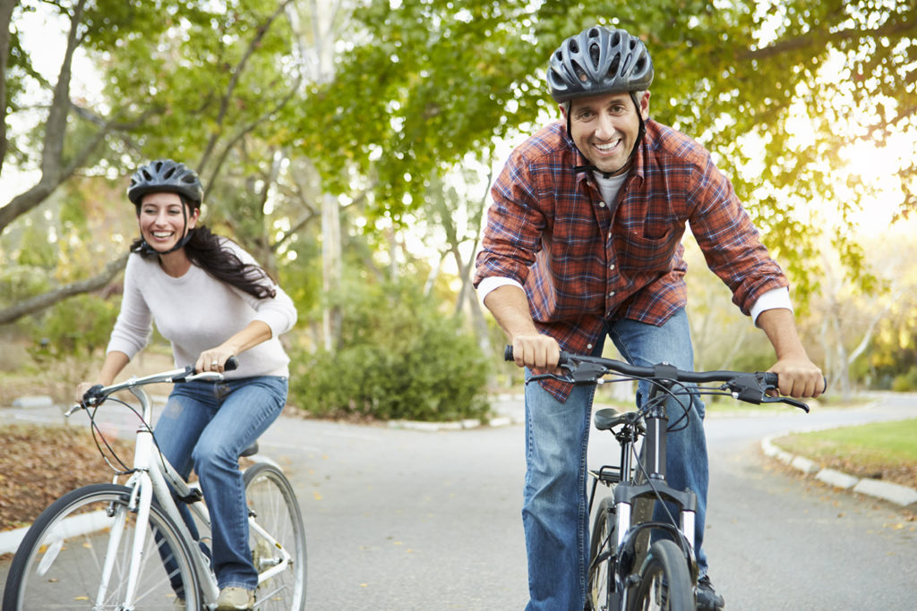 Couple On Cycle Ride In Countryside