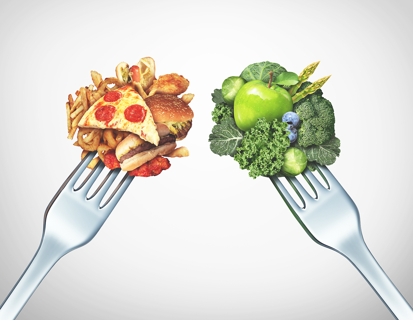 Diet struggle and decision concept and nutrition choices dilemma between healthy good fresh fruit and vegetables or greasy cholesterol rich fast food with two dinner forks competing to decide what to eat.