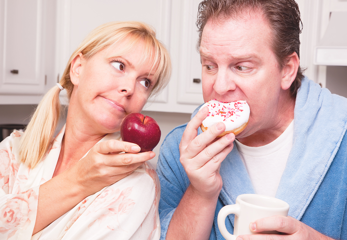 A couple eating foods that may raise their body's acid levels.