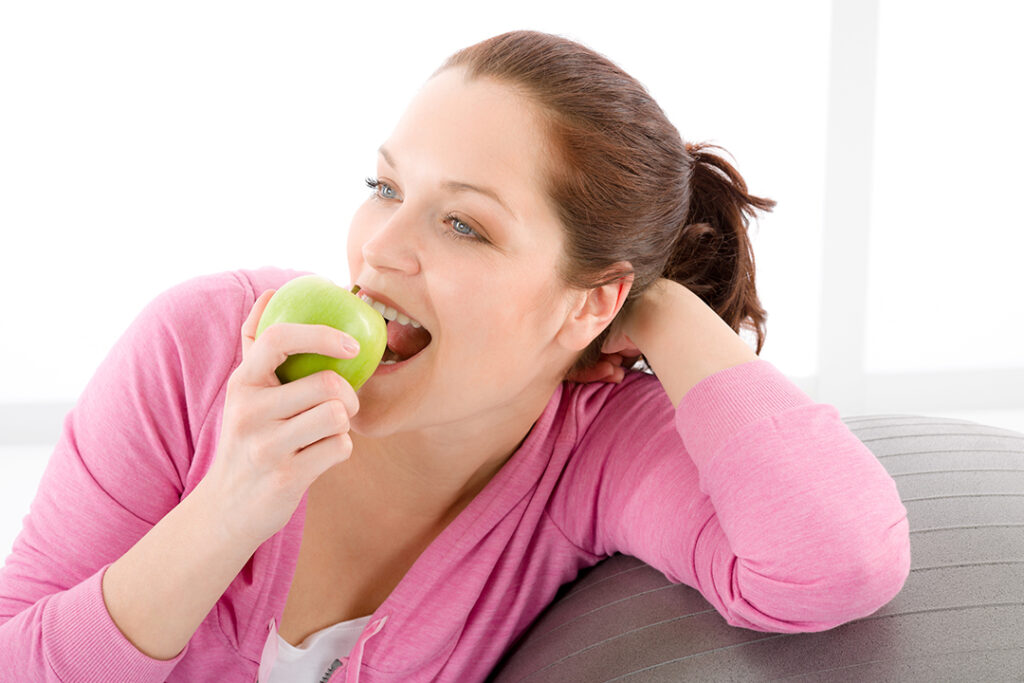Women eating an apple